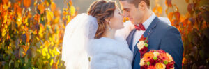 Autumn wedding bride and groom on the street sunny